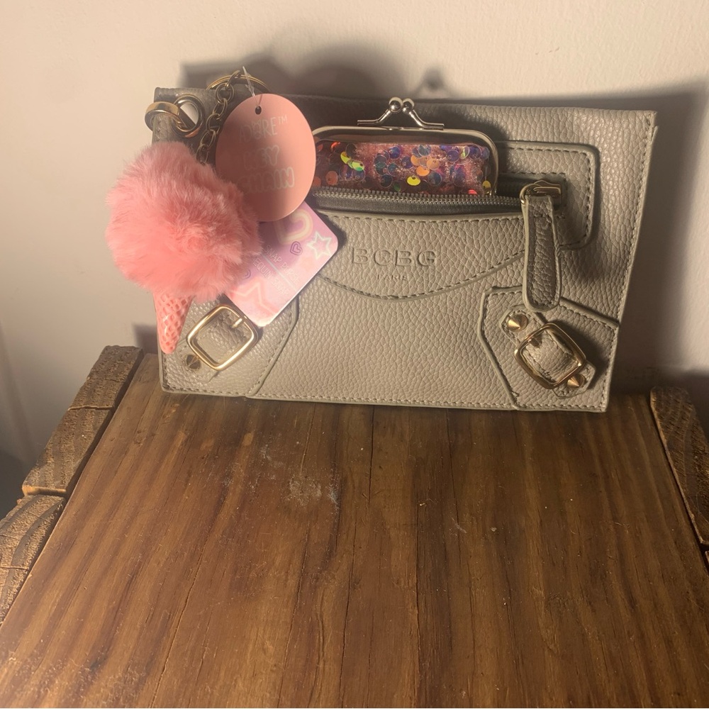 BCBG Taupe Clutch with Pink Pom Pom
